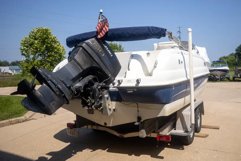 Slide: The Image of 2002 Starcraft AUORA 229 STEP CC DECK boat with Suzuki 150 engine on trailer. - 5