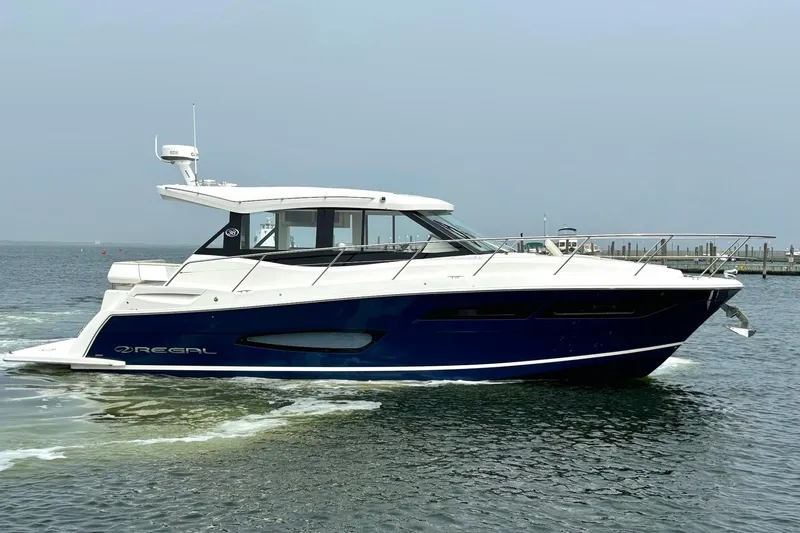 The Image of 2023 Regal 38 Grande Coupe yacht on water, featuring Seakeeper stabilization technology. - 0