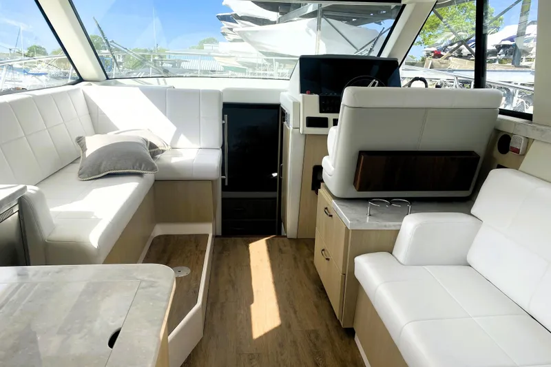 Slide: The Image of Pull-out trash bin in 2023 Regal 38 Grande Coupe yacht kitchen area. - 15