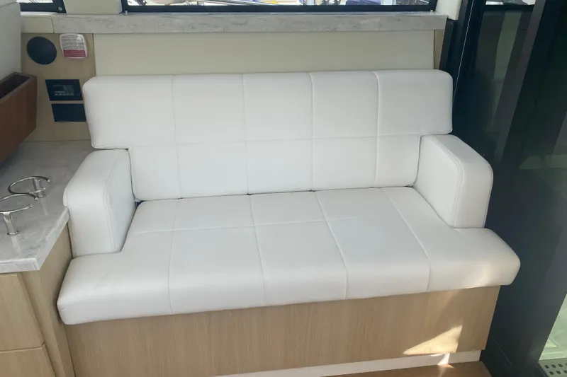 Slide: The Image of 2023 Regal 38 Grande Coupe helm with steering wheel and control panel. - 21