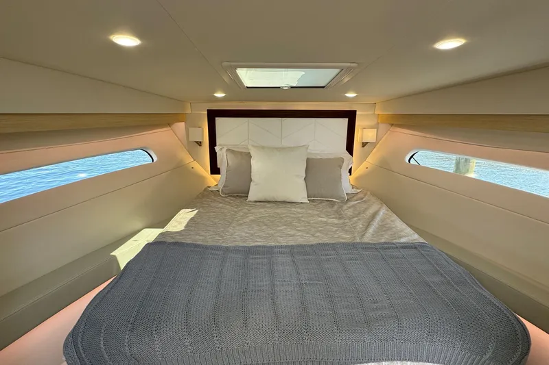 Slide: The Image of White leather seating in 2023 Regal 38 Grande Coupe interior, featuring modern design and comfort. - 22