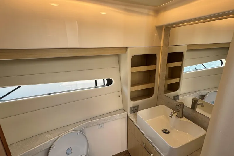 Slide: The Image of Luxurious cabin interior of 2023 Regal 38 Grande Coupe yacht with cozy bedding. - 23