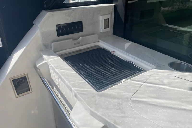 Slide: The Image of 2023 Regal 38 Grande Coupe interior with sleek countertop and modern glass door. - 9