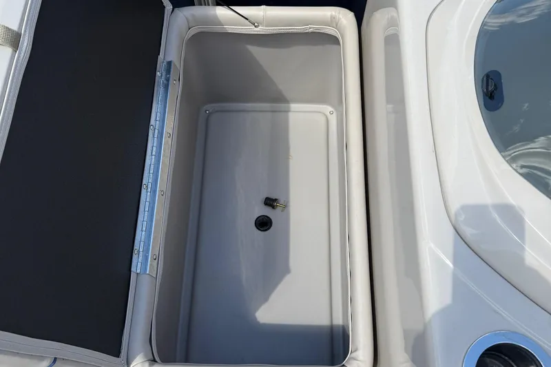 Slide: The Image of Open storage compartment on 2016 Sylvan Mirage Fish 8520 4-PT boat. - 12