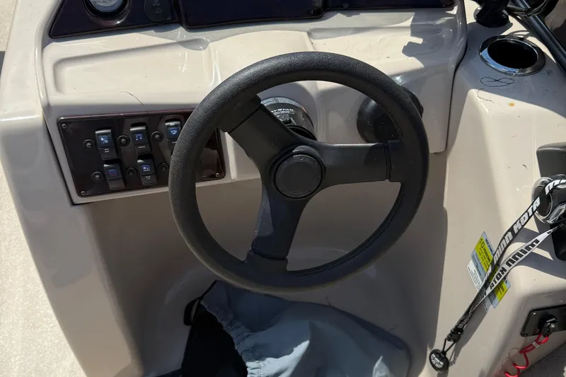 Slide: The Image of Steering console of 2016 Sylvan Mirage Fish 8520 4-PT boat with control panel. - 13