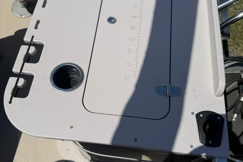 Slide: The Image of 2016 Sylvan Mirage Fish 8520 4-PT boat console with cup holder and measuring scale. - 23