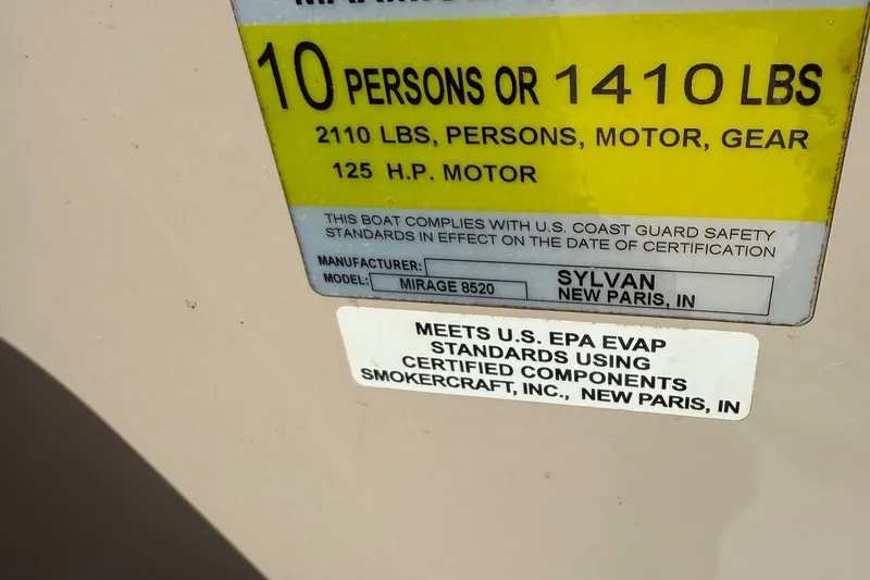 Slide: The Image of 2016 Sylvan Mirage Fish 8520 4-PT capacity label, 10 persons or 1410 lbs, 125 HP motor. - 31