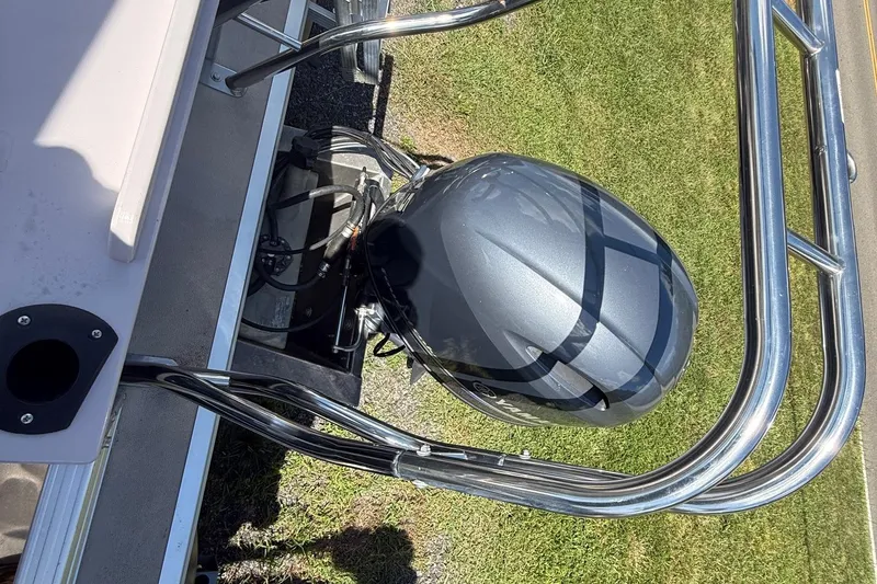 Slide: The Image of 2016 Sylvan Mirage Fish 8520 4-PT boat engine and railing, viewed from above. - 6