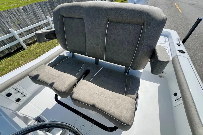 Slide: The Image of 2025 Sea Hunt BX 25 FS boat seat with gray upholstery and armrests. - 10