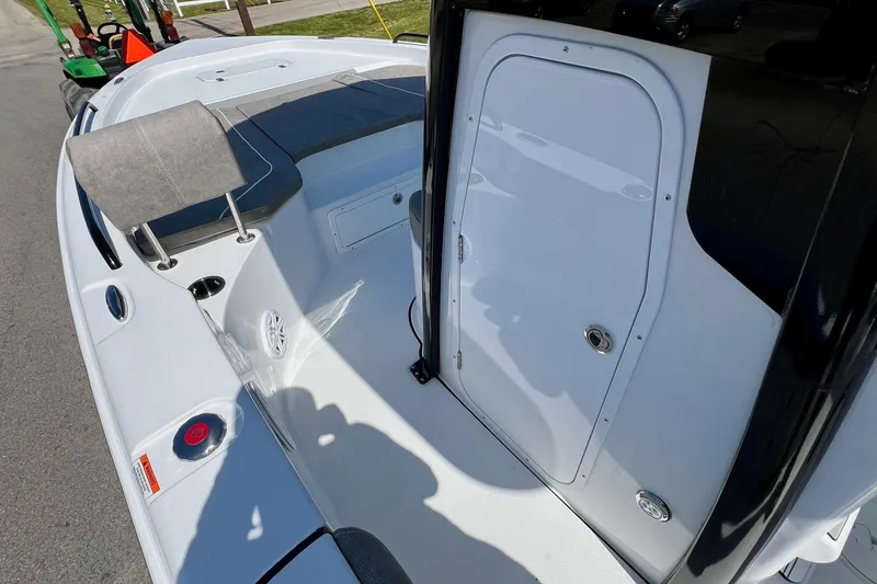 Slide: The Image of 2025 Sea Hunt BX 25 FS boat interior with seating and storage compartment. - 13