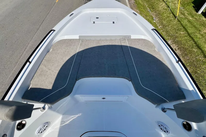 Slide: The Image of 2025 Sea Hunt BX 25 FS boat deck with cushioned seating and storage compartments. - 15