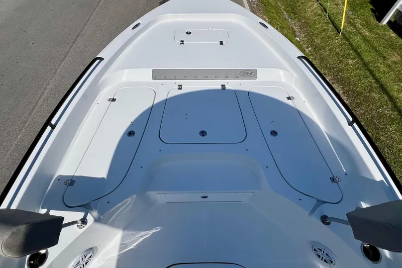 Slide: The Image of 2025 Sea Hunt BX 25 FS boat deck, featuring storage compartments and sleek design. - 16