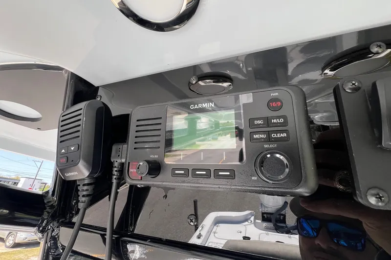Slide: The Image of Garmin marine radio on 2025 Sea Hunt BX 25 FS boat dashboard. - 21