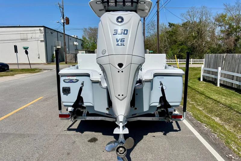 Slide: The Image of 2025 Sea Hunt BX 25 FS boat with powerful V6 4.3L engine on trailer. - 3