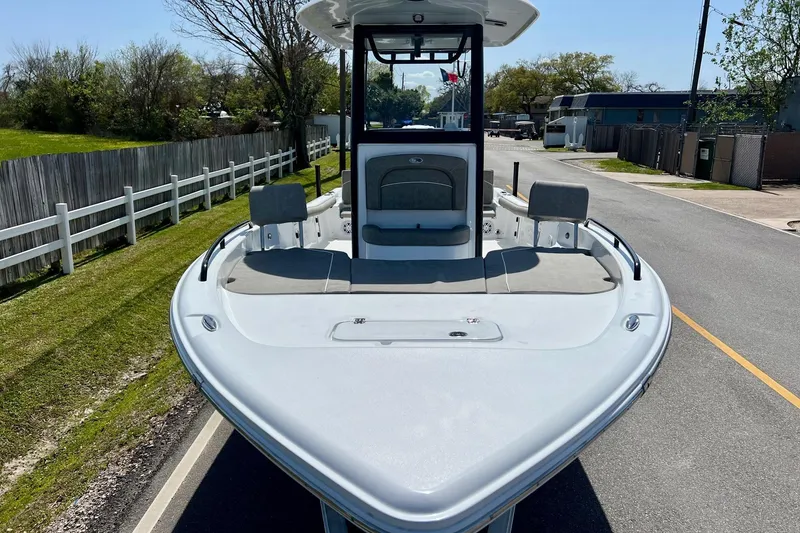 Slide: The Image of 2025 Sea Hunt BX 25 FS boat on a road, showcasing its spacious deck. - 6
