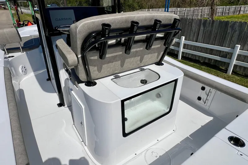 Slide: The Image of 2025 Sea Hunt BX 25 FS boat interior with seating and rod holders. - 9