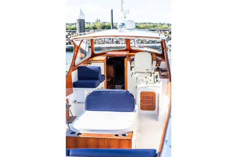 Slide: The Image of 2001 Hinckley Yachts Picnic Boat Classic 36 with elegant seating and wooden accents. - 11