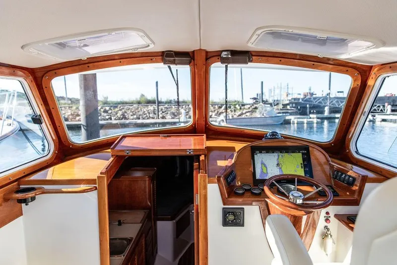 Slide: The Image of Interior view of 2001 Hinckley Yachts Picnic Boat Classic 36 helm with navigation system. - 16