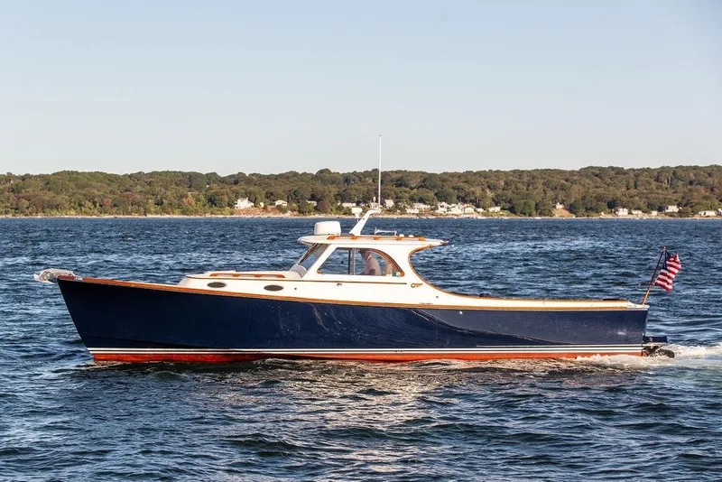 Slide: The Image of 2001 Hinckley Yachts Picnic Boat Classic 36 cruising on open water. - 2