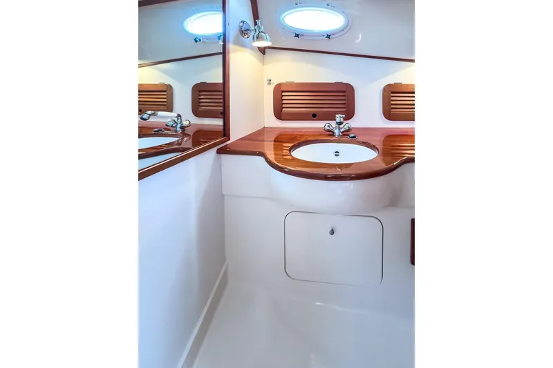 Slide: The Image of Elegant bathroom in 2001 Hinckley Yachts Picnic Boat Classic 36 with wooden accents. - 20