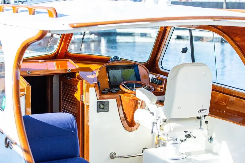 Slide: The Image of Interior of 2001 Hinckley Yachts Picnic Boat Classic 36, featuring helm and seating. - 8