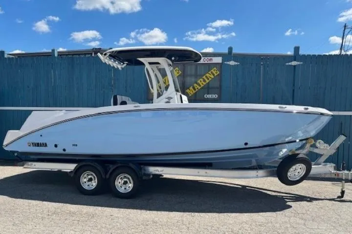 The Image of 2026 Yamaha Boats 255 FSH Sport H on trailer, blue sky background. - 0