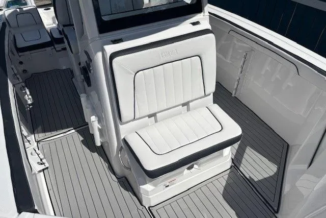 Slide: The Image of 2026 Yamaha Boats 255 FSH Sport H interior with sleek seating and modern design. - 16