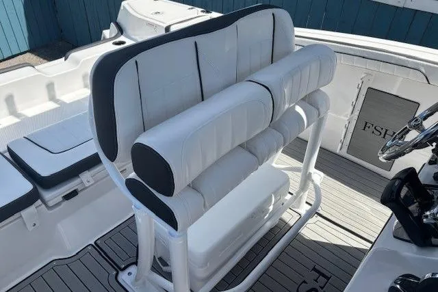 Slide: The Image of 2026 Yamaha Boats 255 FSH Sport H interior seating with sleek, modern design. - 27