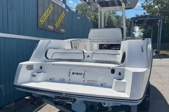 Slide: The Image of 2026 Yamaha Boats 255 FSH Sport H, white exterior, displayed outdoors at Sizzle Marine. - 3