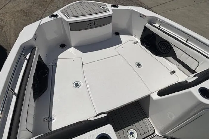 Slide: The Image of 2026 Yamaha Boats 255 FSH Sport H interior, featuring spacious seating and modern design. - 8