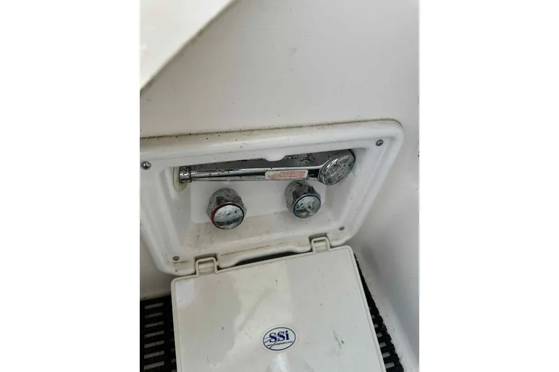 Slide: The Image of Control panel of a 2005 Regal 3350 Sport Cruiser boat. - 11