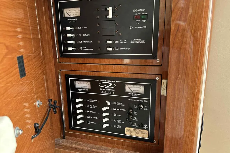 Slide: The Image of Electrical control panel of 2005 Regal 3350 Sport Cruiser with switches and gauges. - 25