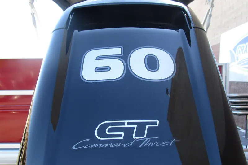 Slide: The Image of Close-up of 60 HP Command Thrust engine on 2026 Sun Tracker Party Barge 18. - 13