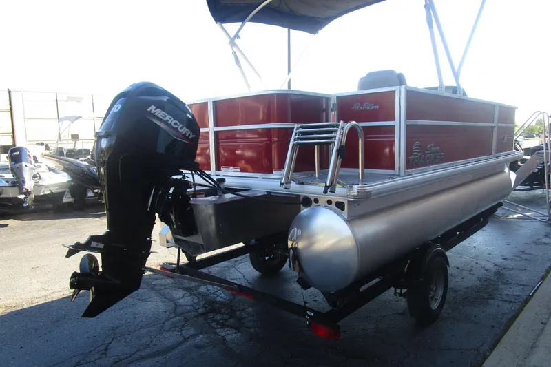 Slide: The Image of 2026 Sun Tracker Party Barge 18 pontoon boat with Mercury outboard motor on trailer. - 14