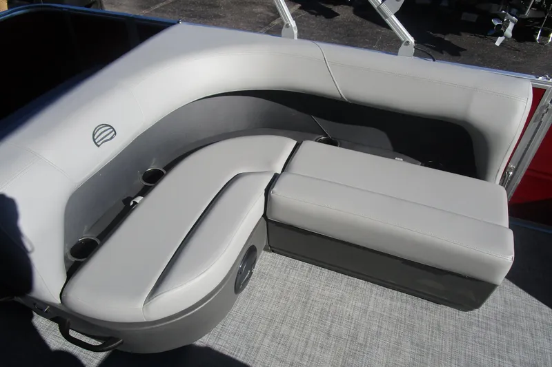 Slide: The Image of 2026 Sun Tracker Party Barge 18 interior seating with cup holders and gray upholstery. - 5