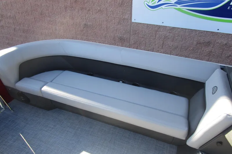 Slide: The Image of 2026 Sun Tracker Party Barge 18 interior seating with gray upholstery. - 6