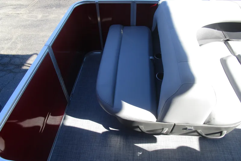 Slide: The Image of 2026 Sun Tracker Party Barge 18 interior with gray seating and cup holders. - 8