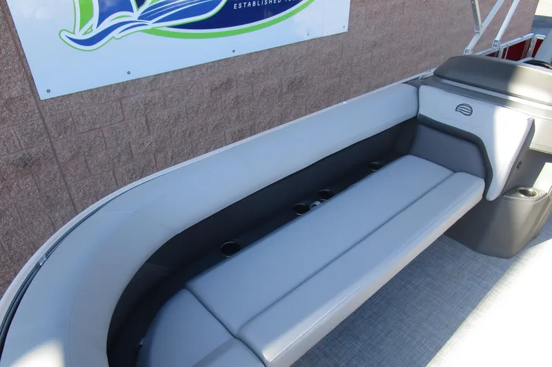 Slide: The Image of 2026 Sun Tracker Party Barge 18 interior seating with cup holders, showcasing modern design. - 9