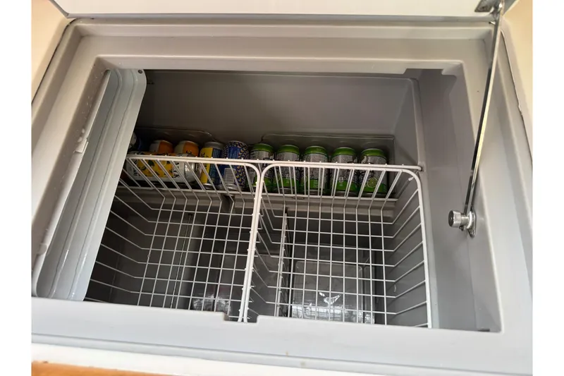 Slide: The Image of Open fridge on Jeanneau 409 yacht, stocked with canned beverages, 2013 model. - 27