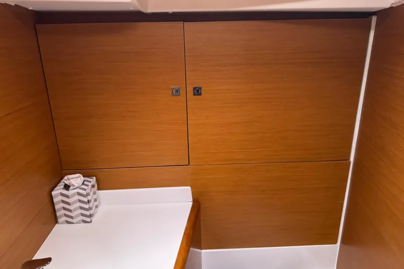 Slide: The Image of Interior of 2013 Jeanneau 409 sailboat with wooden cabinetry and countertop. - 31