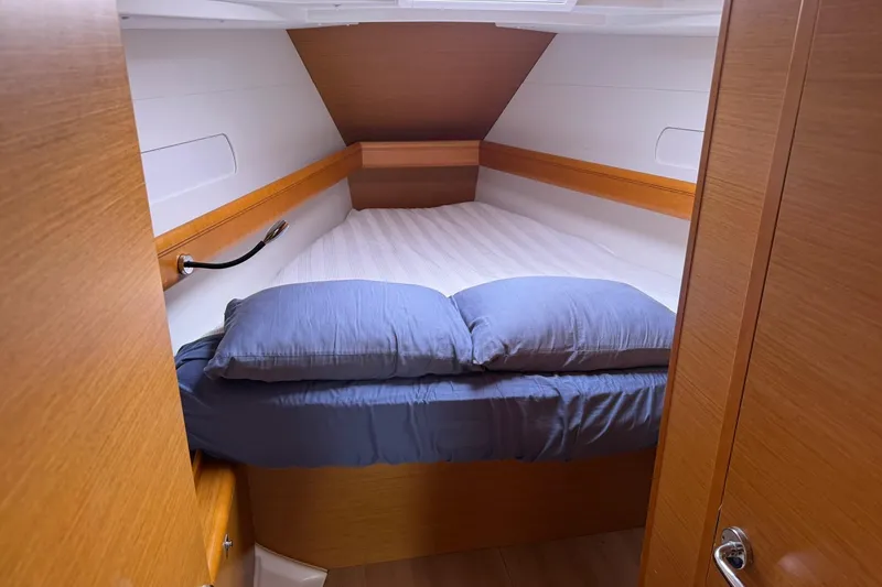 Slide: The Image of Cozy cabin interior of 2013 Jeanneau 409 sailboat with comfortable bedding. - 32