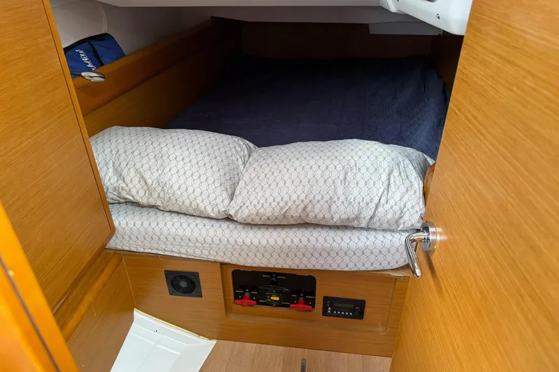 Slide: The Image of Cozy cabin interior of 2013 Jeanneau 409 sailboat with bed and wooden finish. - 35