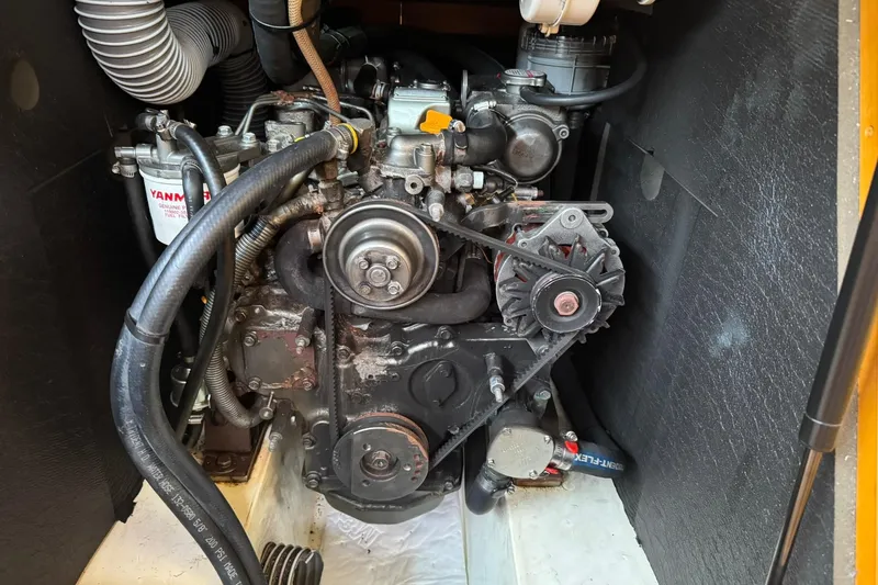 Slide: The Image of Engine compartment of a 2013 Jeanneau 409 sailboat, featuring a Yanmar engine. - 37