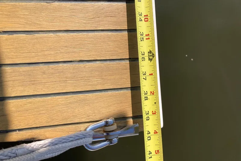 Slide: The Image of Tape measure on Jeanneau Sun Odyssey 409 deck, 2013 model, showing precise measurement. - 41