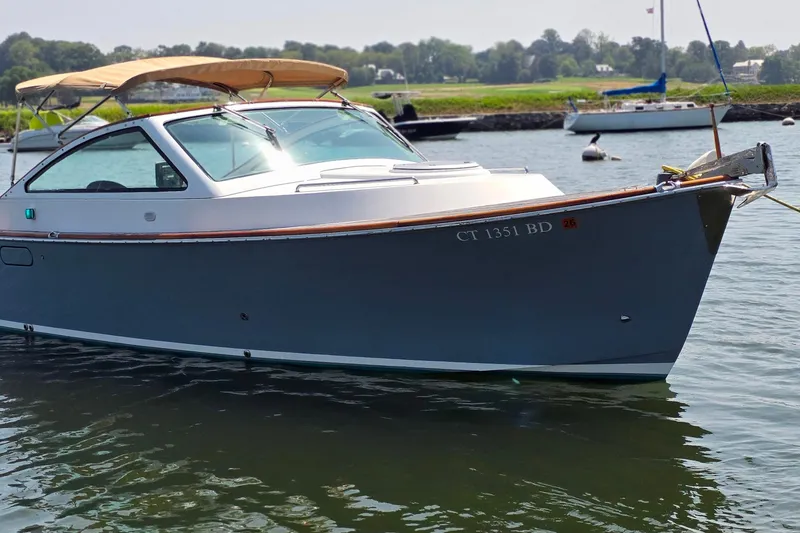 The Image of 2006 Nordic Star 33 Runabout boat docked on calm water. - 0
