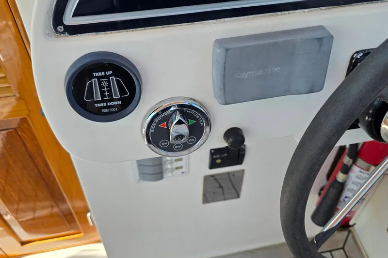 Slide: The Image of Control panel of a 2006 Nordic Star 33 Runabout boat with steering wheel. - 15