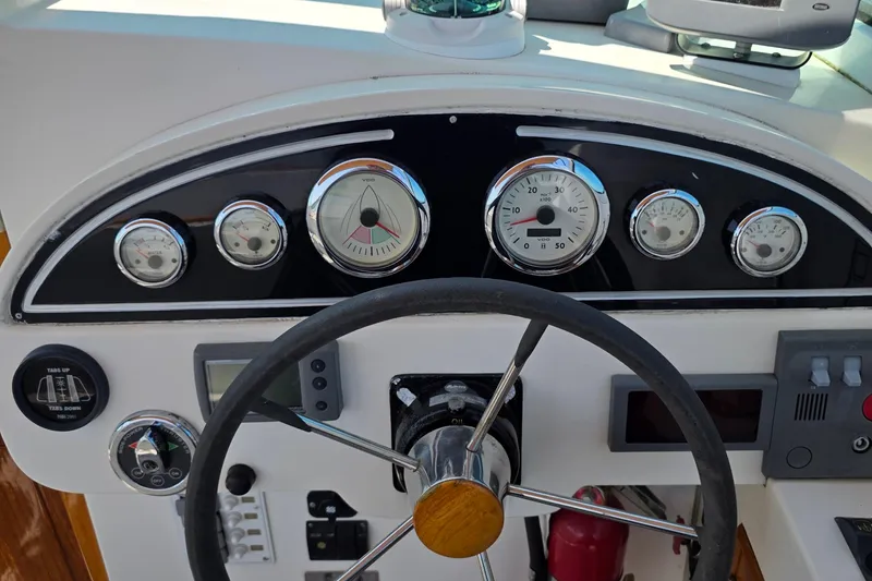 Slide: The Image of Steering console of a 2006 Nordic Star 33 Runabout with gauges and controls. - 18