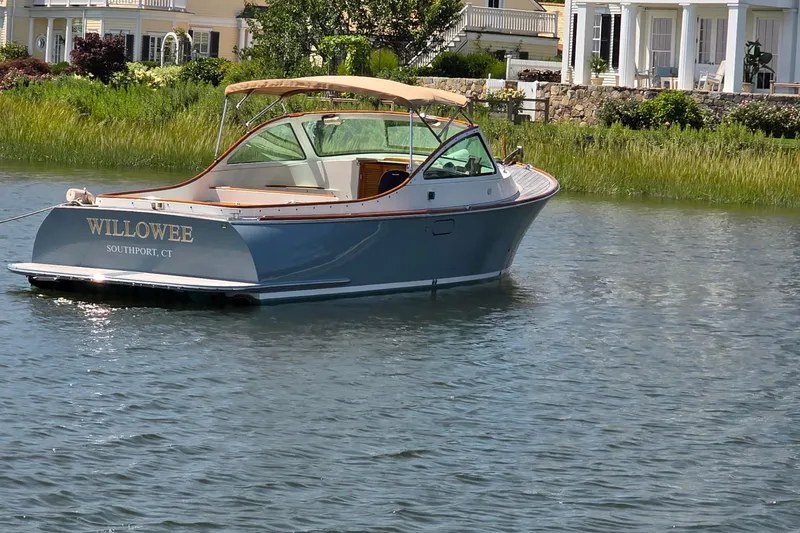 Slide: The Image of 2006 Nordic Star 33 Runabout boat named "WILLOWEE" on calm water near houses. - 6