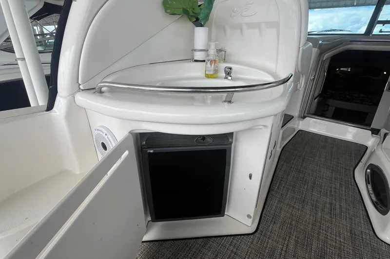 Slide: The Image of 2004 Sea Ray 340 Sundancer interior with sink and mini fridge. - 14
