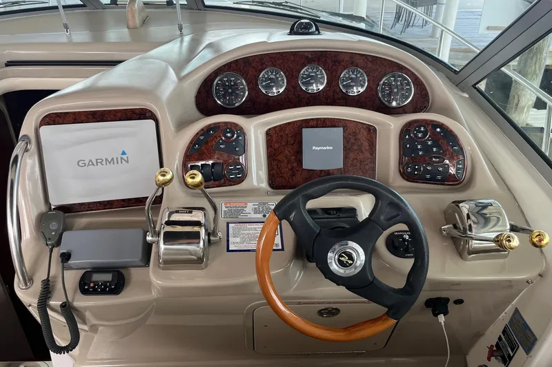 Slide: The Image of 2004 Sea Ray 340 Sundancer helm with Garmin and Raymarine navigation systems. - 15